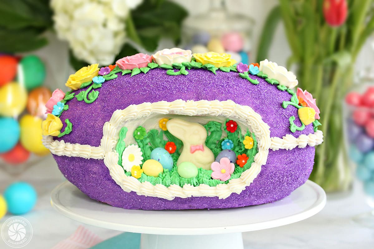 Sugar Easter Egg Cake with purple sugar and buttercream flowers on top