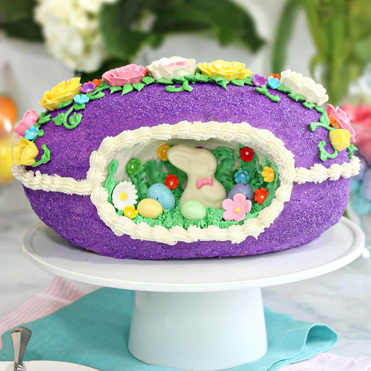 Sugar Easter Egg Cake on a white cake platter.