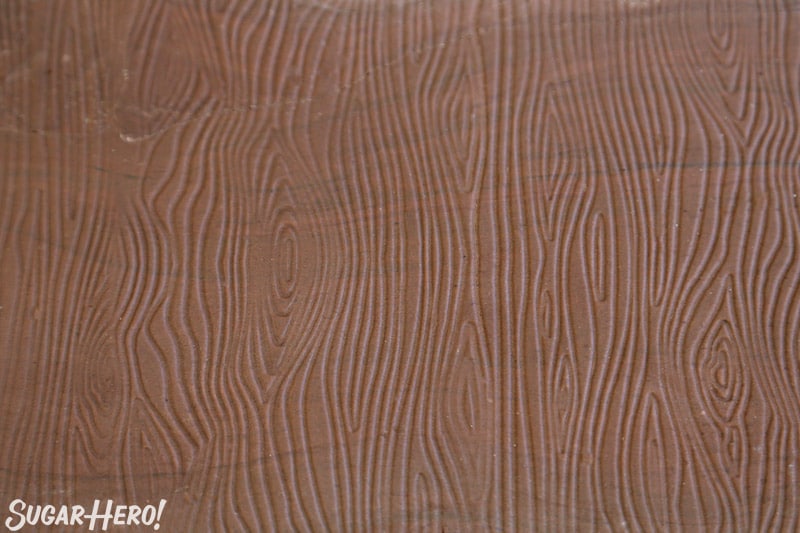 Close-up of brown fondant with wood grain texture