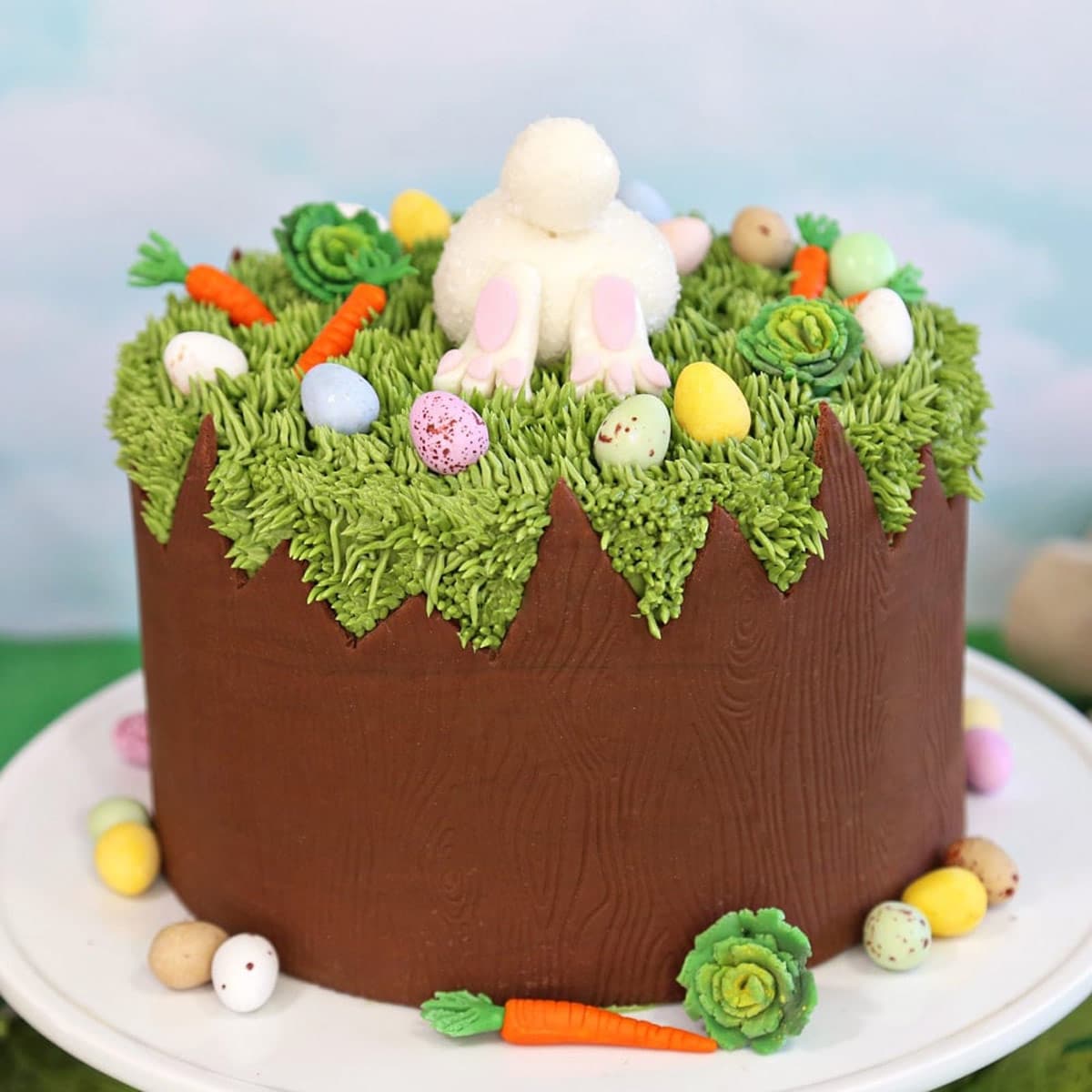 A Chocolate Easter Bunny Cake on a small white cake plate.