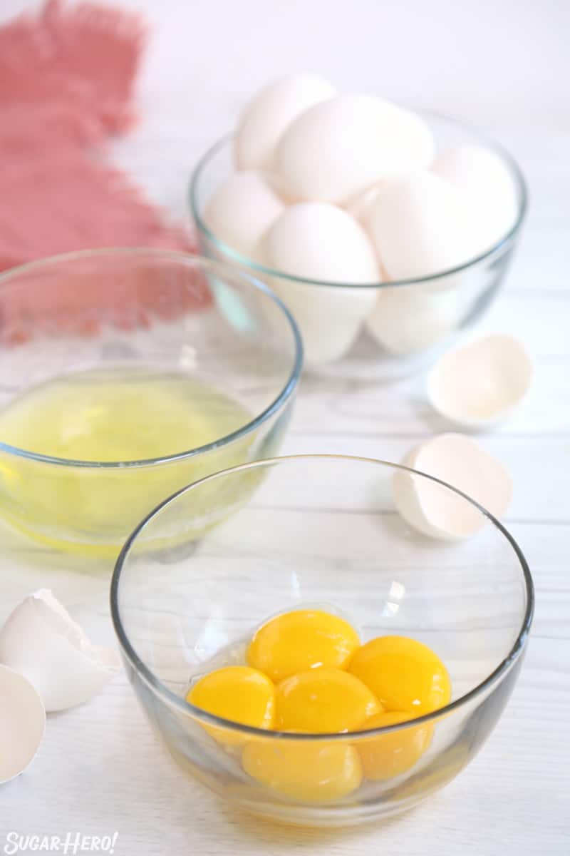 Separated Eggs - three bowls with whole eggs, egg whites, and egg yolks