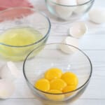 3 bowls containing egg yolks, egg whites and whole eggs.