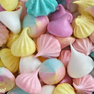 Colorful meringue cookies of assorted shapes and sizes.