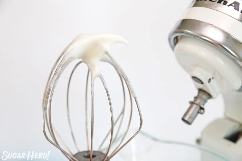 Whisk attachment showing meringue mixture with soft peaks