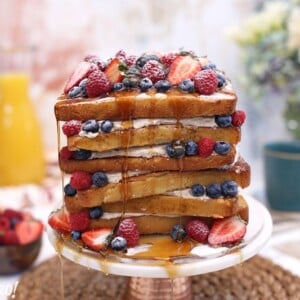 French Toast Cake on a cake stand | From SugarHero.com