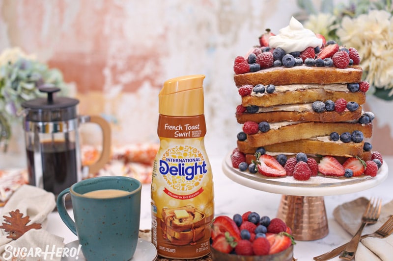 Picture of coffee mug, coffee creamer, and French toast cake on cake stand