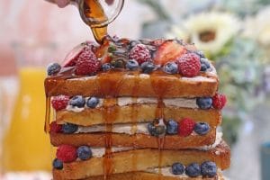Photo of a French Toast Cake with text overlay for Pinterest.