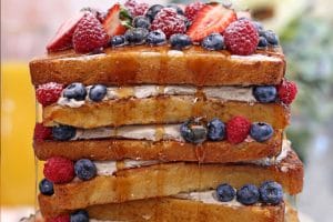 Photo of a French Toast Cake with text overlay for Pinterest.