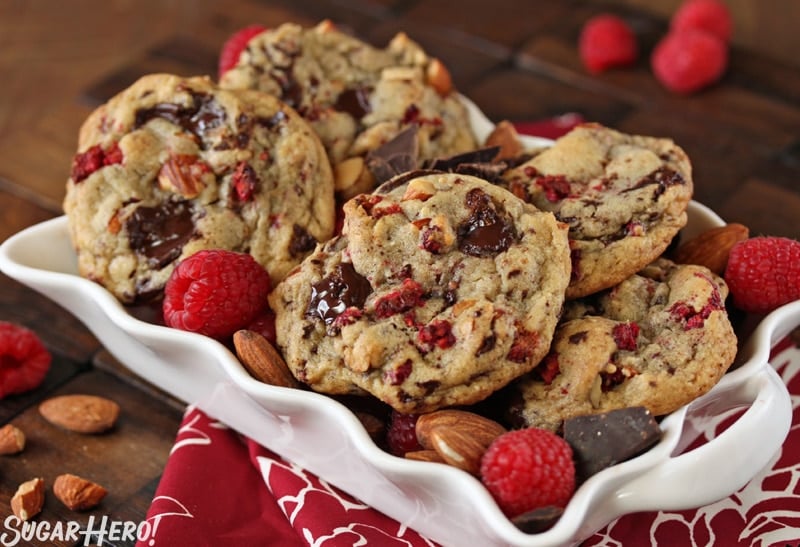 Raspberry Almond Chocolate Chunk Cookies - A shot of the cookies displayed in a platter. | From SugarHero.com