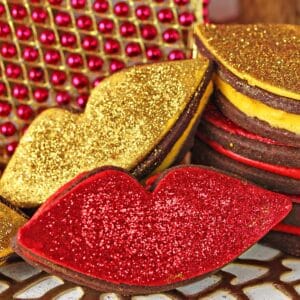 A couple Red Hot Love Cookies next to shiny decor.