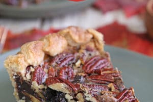 Slice of Deep Dish Pecan Pie with overlay text for Pinterest