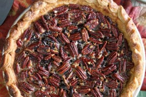 Overhead shot of Deep Dish Pecan Pie with overlay text for Pinterest