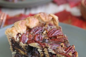 Slice of Deep Dish Pecan Pie with overlay text for Pinterest