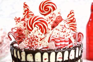Picture of Candy Cane Mousse Cake with chocolate cake layers and overlay text for Pinterest
