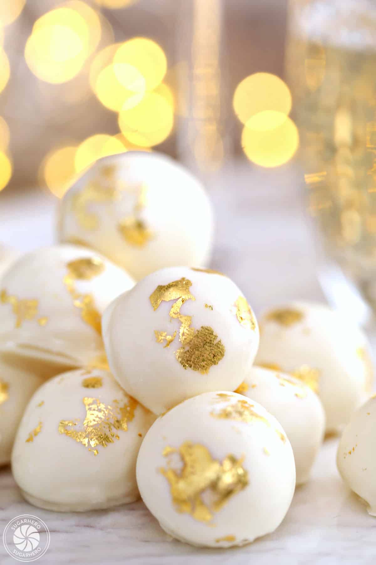 Close-up of Champagne White Chocolate Truffles with gold leaf decorations