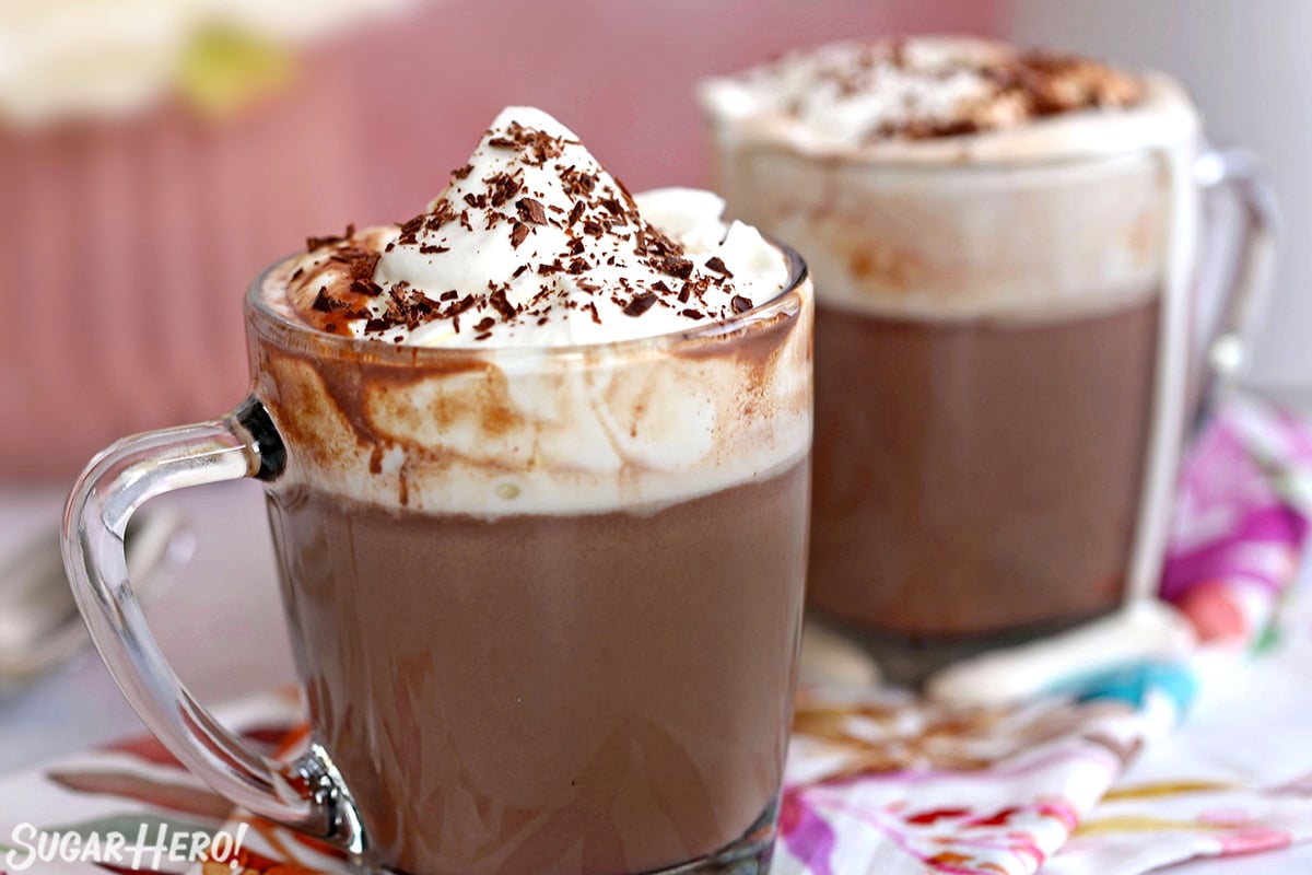 Slow Cooker Hot Chocolate with whipped cream and chocolate shavings on top