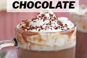 Slow Cooker Hot Chocolate topped with whipped cream, with text overlay for Pinterest