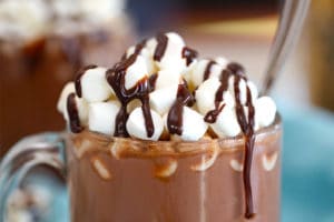Slow Cooker Hot Chocolate topped with mini marshmallows, with text overlay for Pinterest