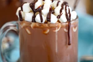 Slow Cooker Hot Chocolate topped with mini marshmallows, with text overlay for Pinterest