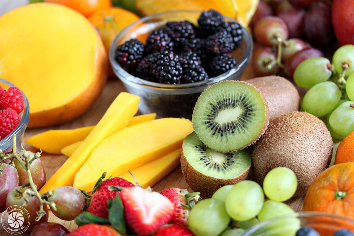 Close-up of various fresh fruits on a wooden platter