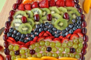 Easter Egg Fruit Pizza photo with text overlay for Pinterest.