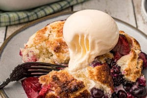 Picture of Mixed Berry Cobbler with text overlay for Pinterest.