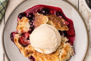 Picture of Mixed Berry Cobbler with text overlay for Pinterest.