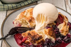 Picture of Mixed Berry Cobbler with text overlay for Pinterest.