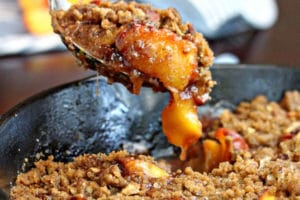Picture of Cast Iron Peach Crisp with text overlay for Pinterest