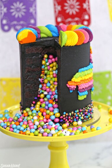 Chocolate pinata cake cut open, with colorful candy spilling out