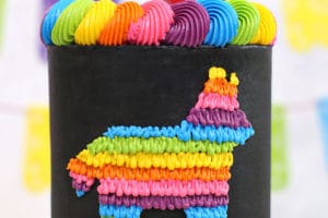 Picture of black and neon pinata cake with text overlay for Pinterest