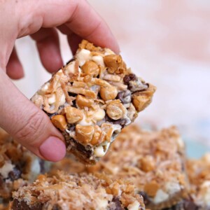 Hand holding up a Seven Layer Bar