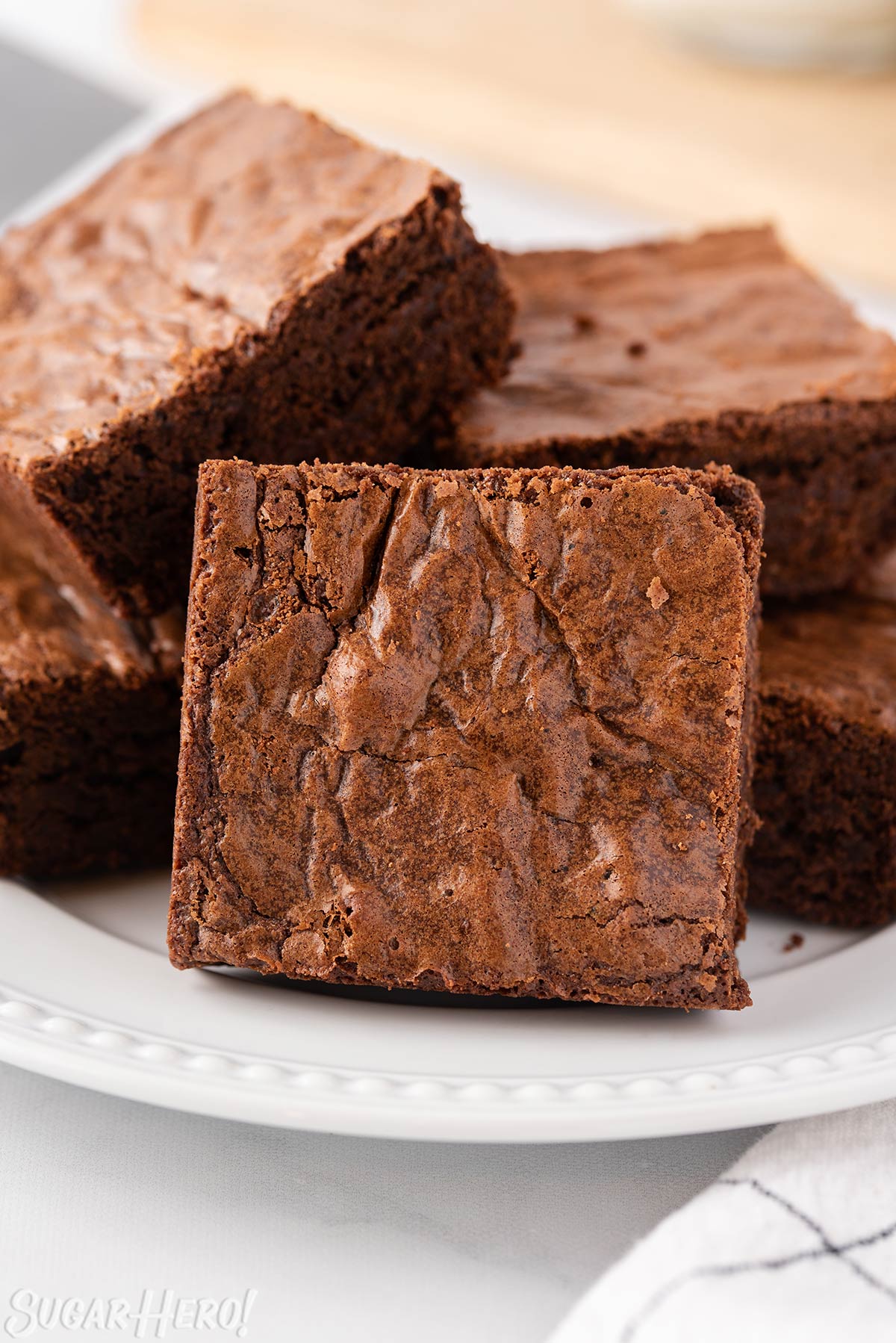 Brown Butter Brownies arranged on white plate