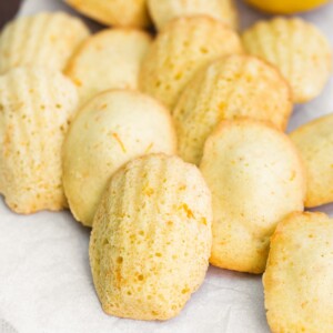Close-up of Lemon Madeleines on a white piece of parchment