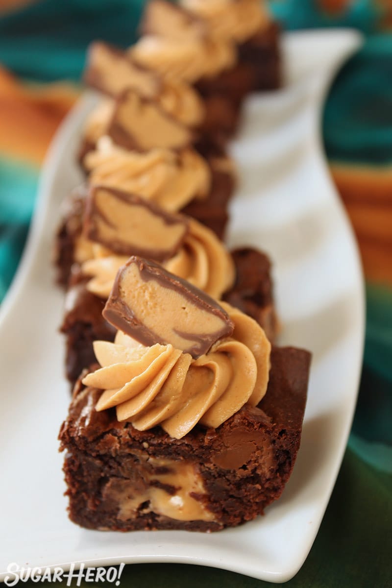 Line of Peanut Butter Cup Brownies on a white tray