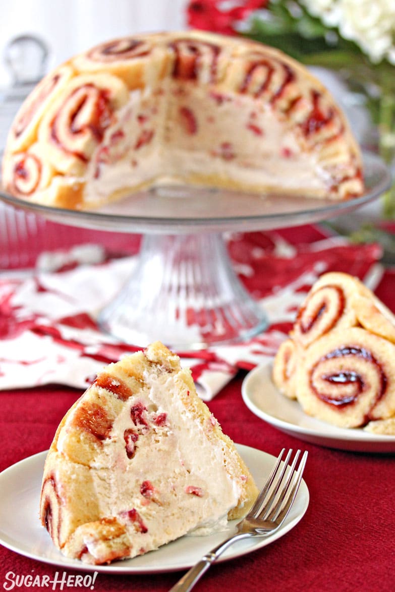 Slice of Charlotte Royale Cake with cut cake in background