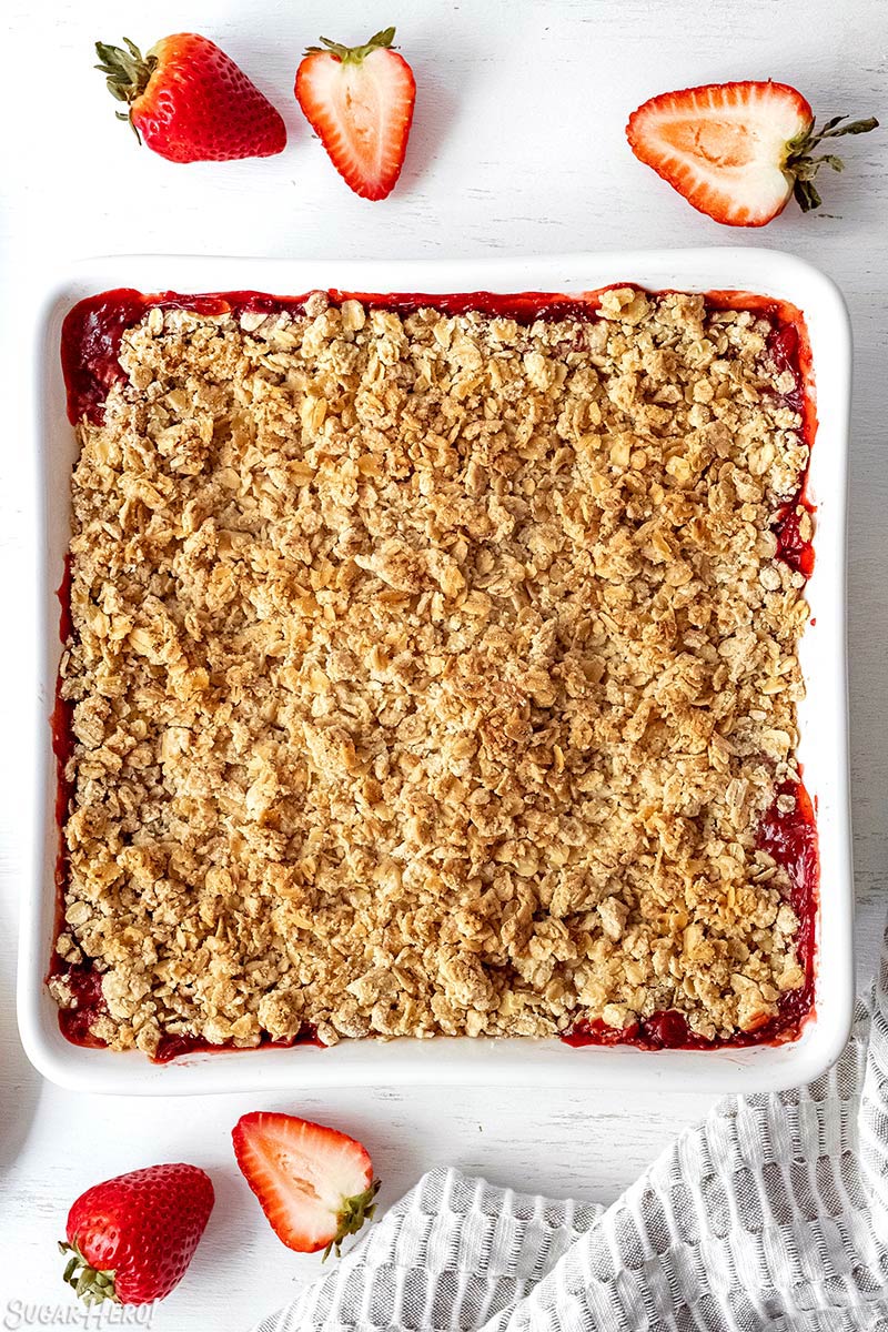 Overhead shot of Strawberry Crisp baked in a square white pan.