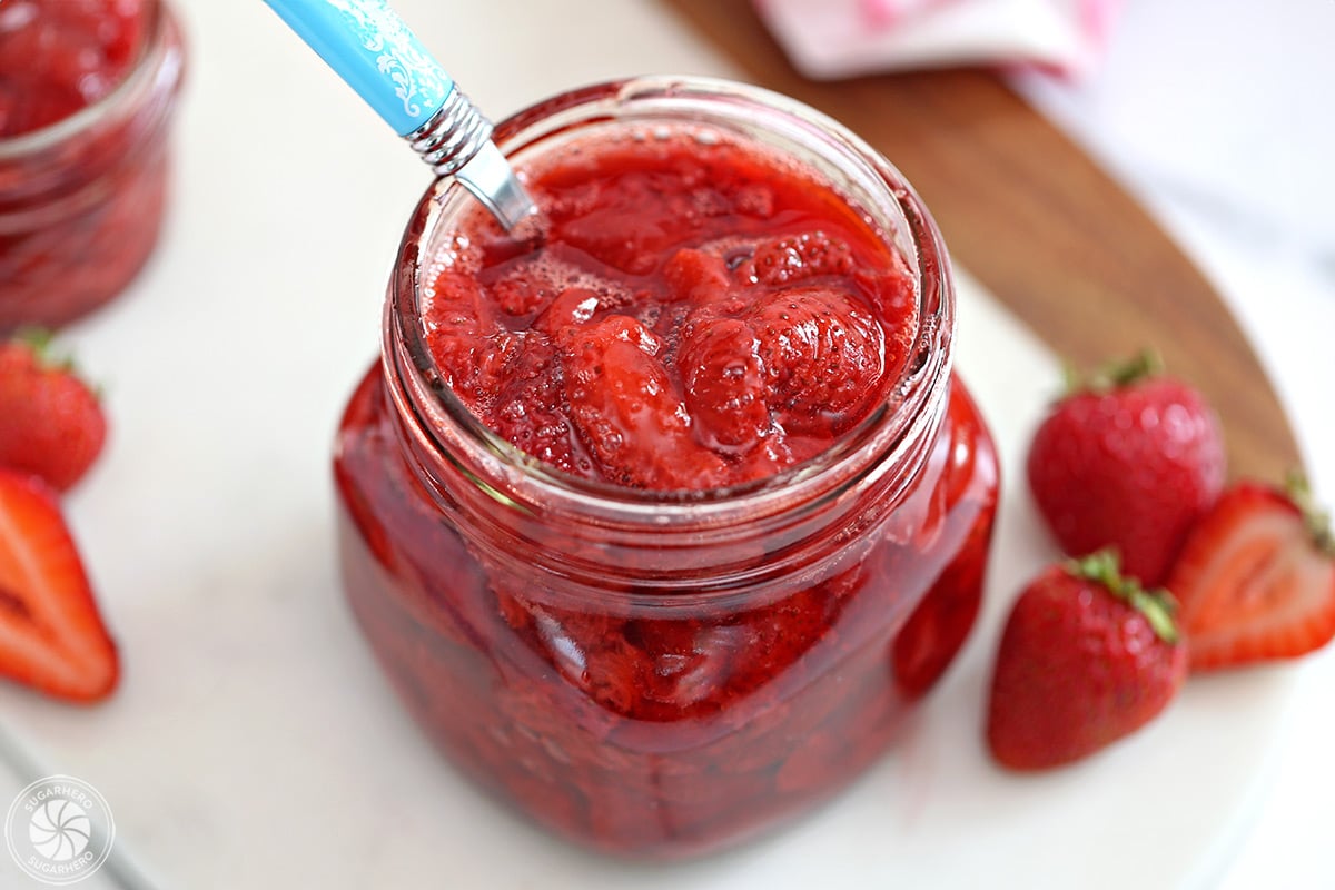 Overhead shot of Strawberry Sauce in a glass jar.