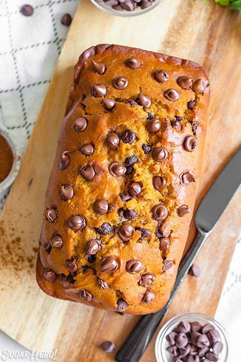 Overhead shot of Pumpkin Chocolate Chip Bread on a wooden cutting board.