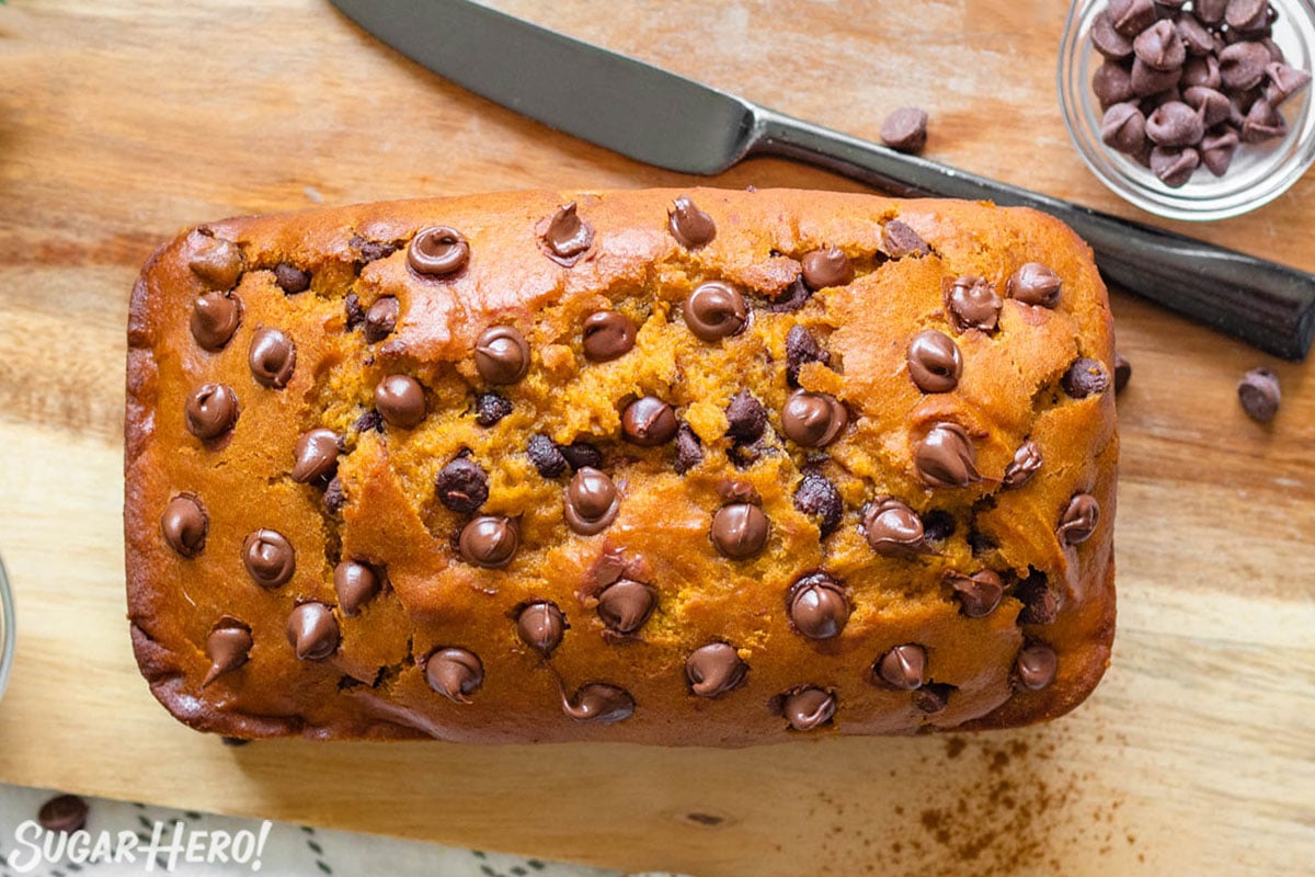 Overhead shot of Pumpkin Chocolate Chip Bread on a wooden cutting board.