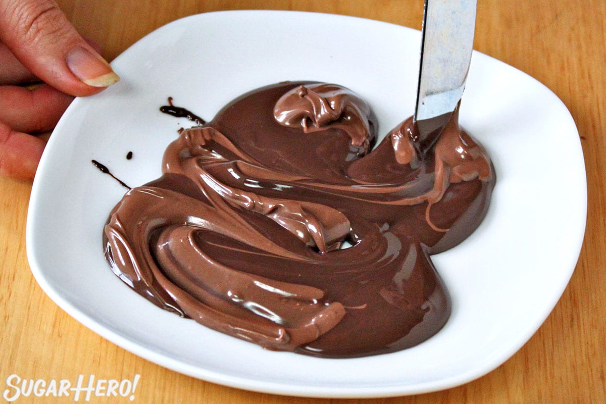 Swirling milk and dark chocolate together.