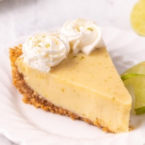 Close-up shot of Key Lime Pie on a white plate.