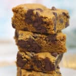 Stack of three Pumpkin Chocolate Chip Bars on top of each other.