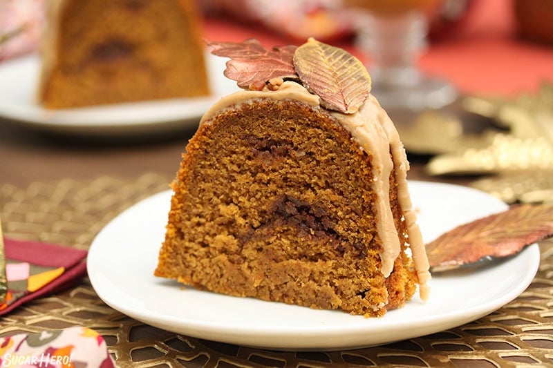 Slice of pumpkin cake with a cinnamon swirl in the middle.