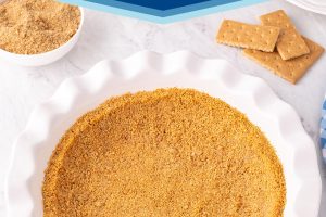 Photo of Graham Cracker Crust with text overlay for Pinterest.