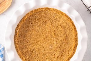 Photo of Graham Cracker Crust with text overlay for Pinterest.