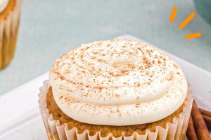 Photo of pumpkin spice cupcake with the words "pumpkin spice cupcakes" overlaid for Pinterest.