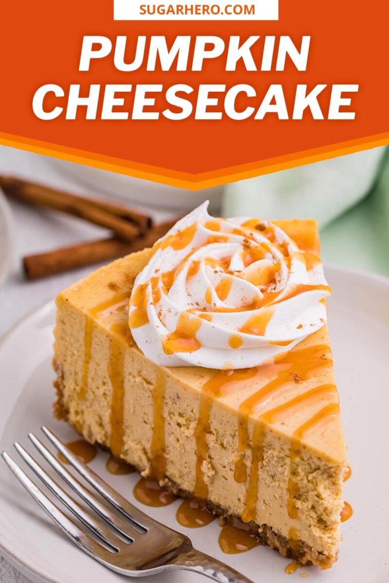 Slice of pumpkin spice cheesecake topped with whipped cream and caramel sauce next to a fork placed on a round white plate.