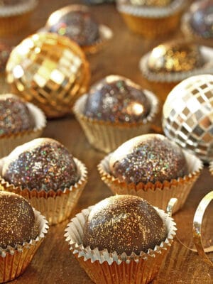 Arrangement of Sparkling Disco Chocolate Truffles on a wooden surface.