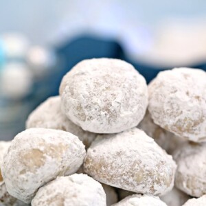 Close-up of snowball cookies dusted with powdered sugar.
